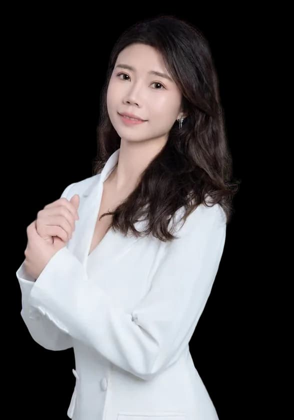 Photo of Laura, the real Chinese teacher behind the app, smiling in a white blazer